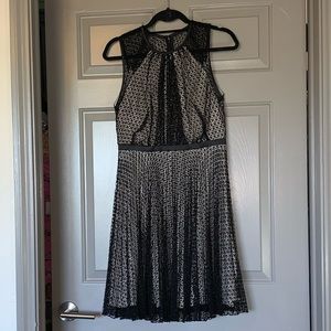 Elegant knee length dress. Black with a tan slip.